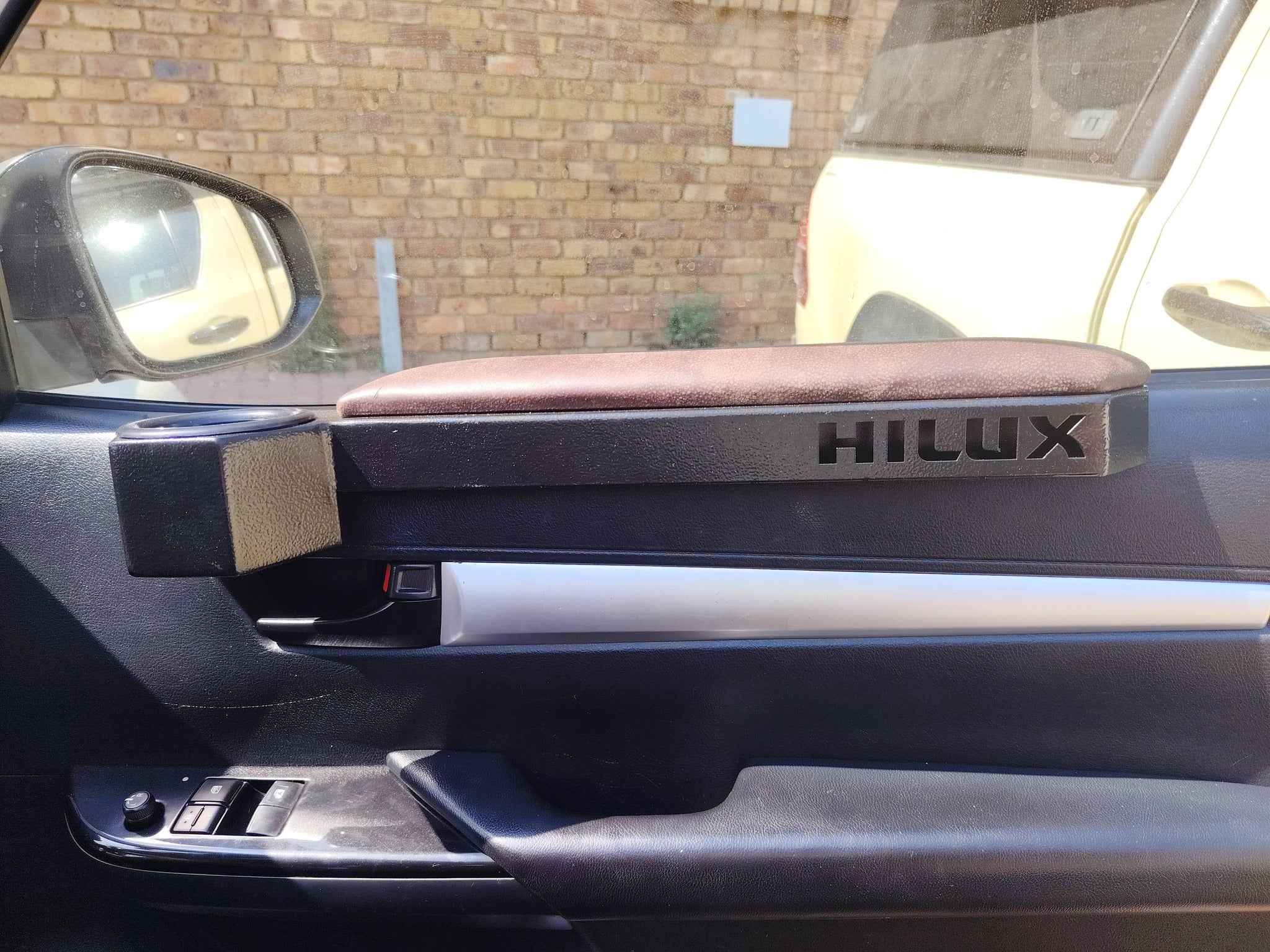 Custom Toyota Hilux Armrest – Steel with Integrated Cup Holder (2006–Current)